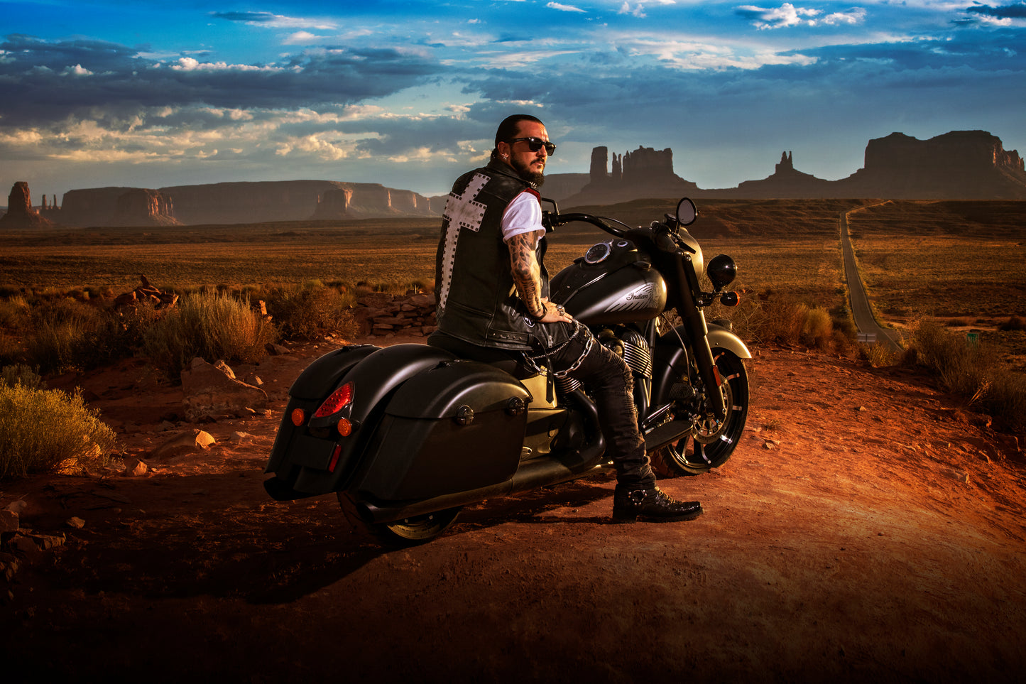 Singer Crucifix on Indian Motorcycle at Forrest Gump Point in Monument Valley Arizona. SaintCruce